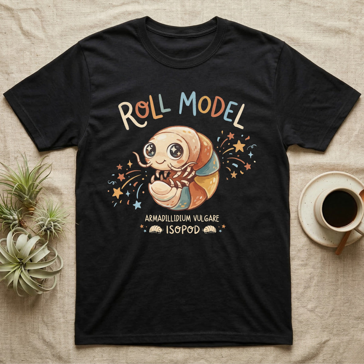 Roly Poly Isopod Roll Model T-Shirt in Black — Storybook roly poly curled into a roll with starry eyes and confetti under hand-lettered "Roll Model".