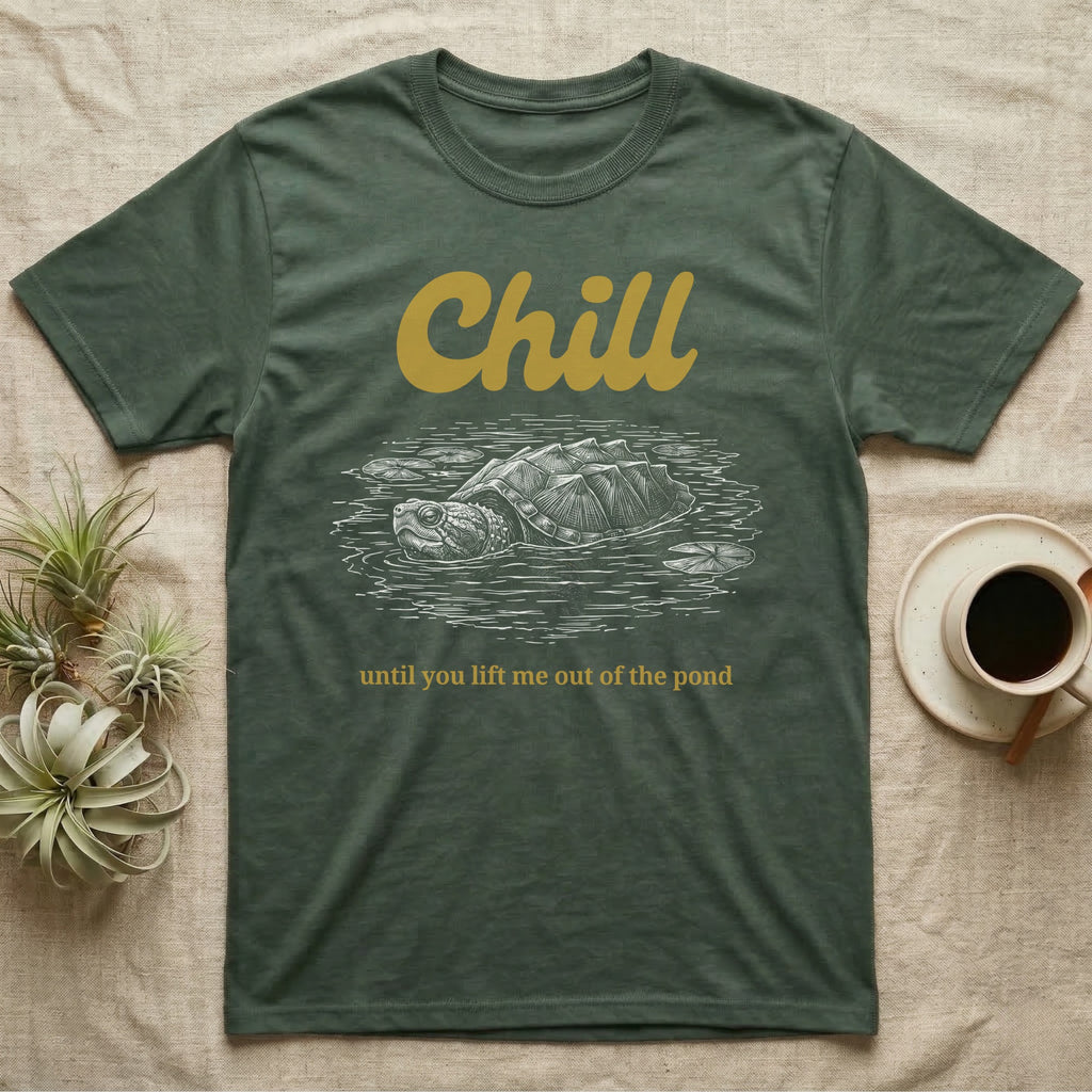Snapping Turtle Chill T-Shirt in Military Green — White-line engraving of a snapping turtle floating among lily pads under the word Chill