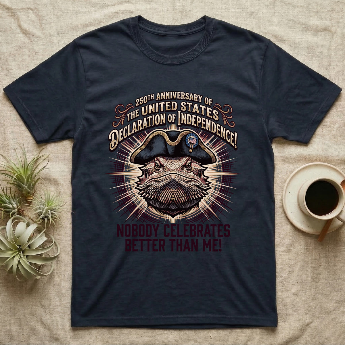 Bearded Dragon Declaration T-Shirt in Navy — Ornate engraved bearded dragon portrait in a tricorn hat on a cream sunburst with Nobody Celebrates Better Than Me.