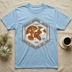Blue t-shirt with hexagonal graphic of a snake and text about "Genetic Wonder - Reftail".