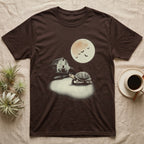 Box Turtle Moonlight T-Shirt in Dark Chocolate — An eastern box turtle mid-step across a moonlit yard, a derelict barn behind it and a large cream moon high right.