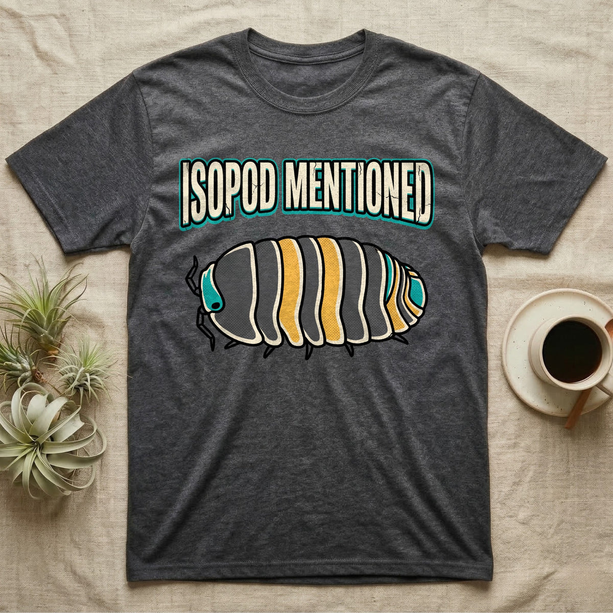 Isopod Mentioned T-Shirt in Dark Heather — Bold-vector illustration of a rubber-ducky Cubaris isopod hero under big block caps reading Isopod Mentioned.