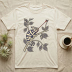 Veiled Chameleon The Strike T-Shirt in Natural — Ukiyo-e style woodblock illustration of a veiled chameleon mid-tongue-strike among foliage.