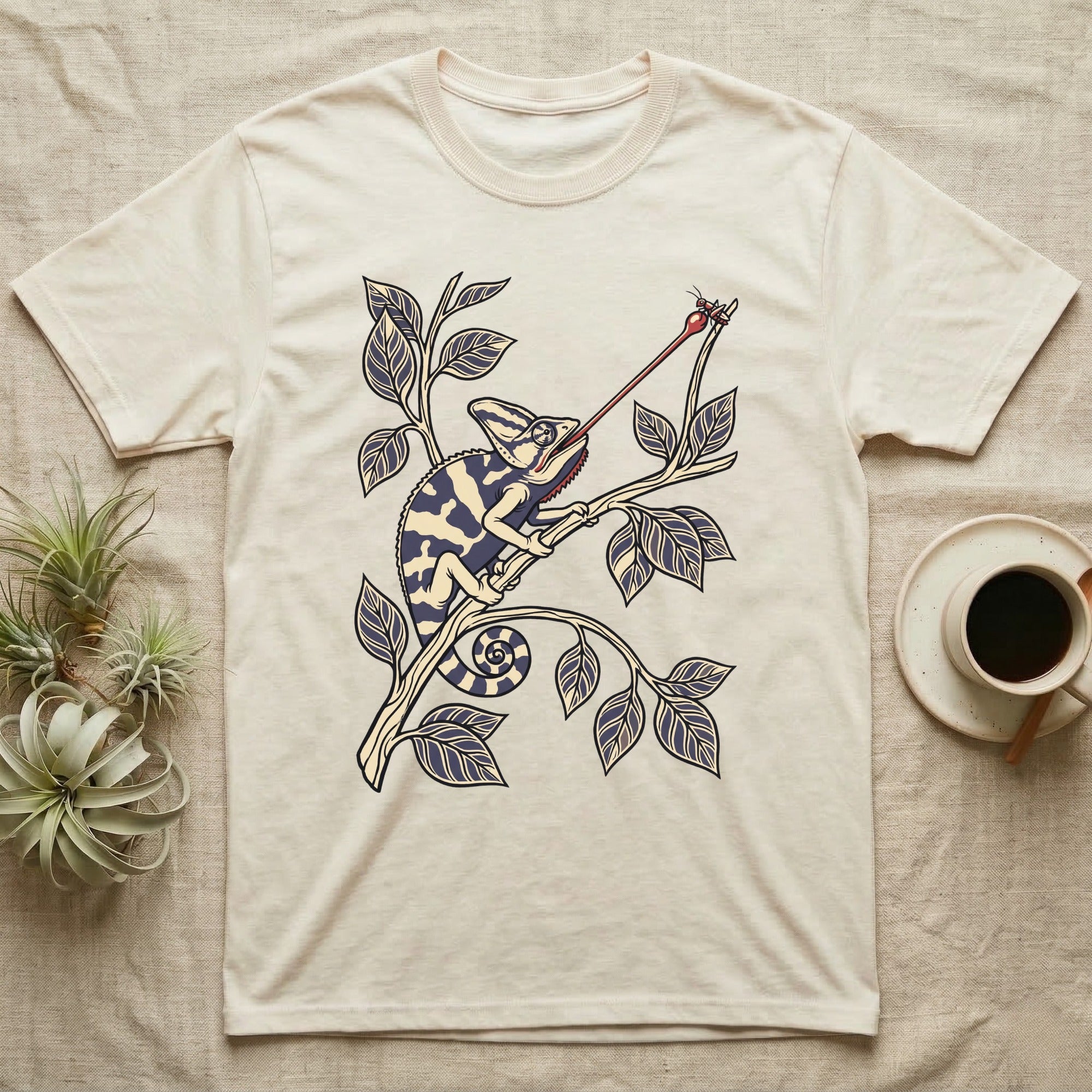 Veiled Chameleon The Strike T-Shirt in Natural — Ukiyo-e style woodblock illustration of a veiled chameleon mid-tongue-strike among foliage.