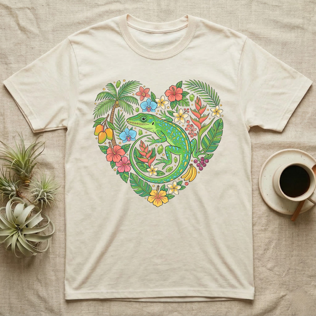 T-shirt with a heart-shaped design of a lizard, tropical plants, and fruit.