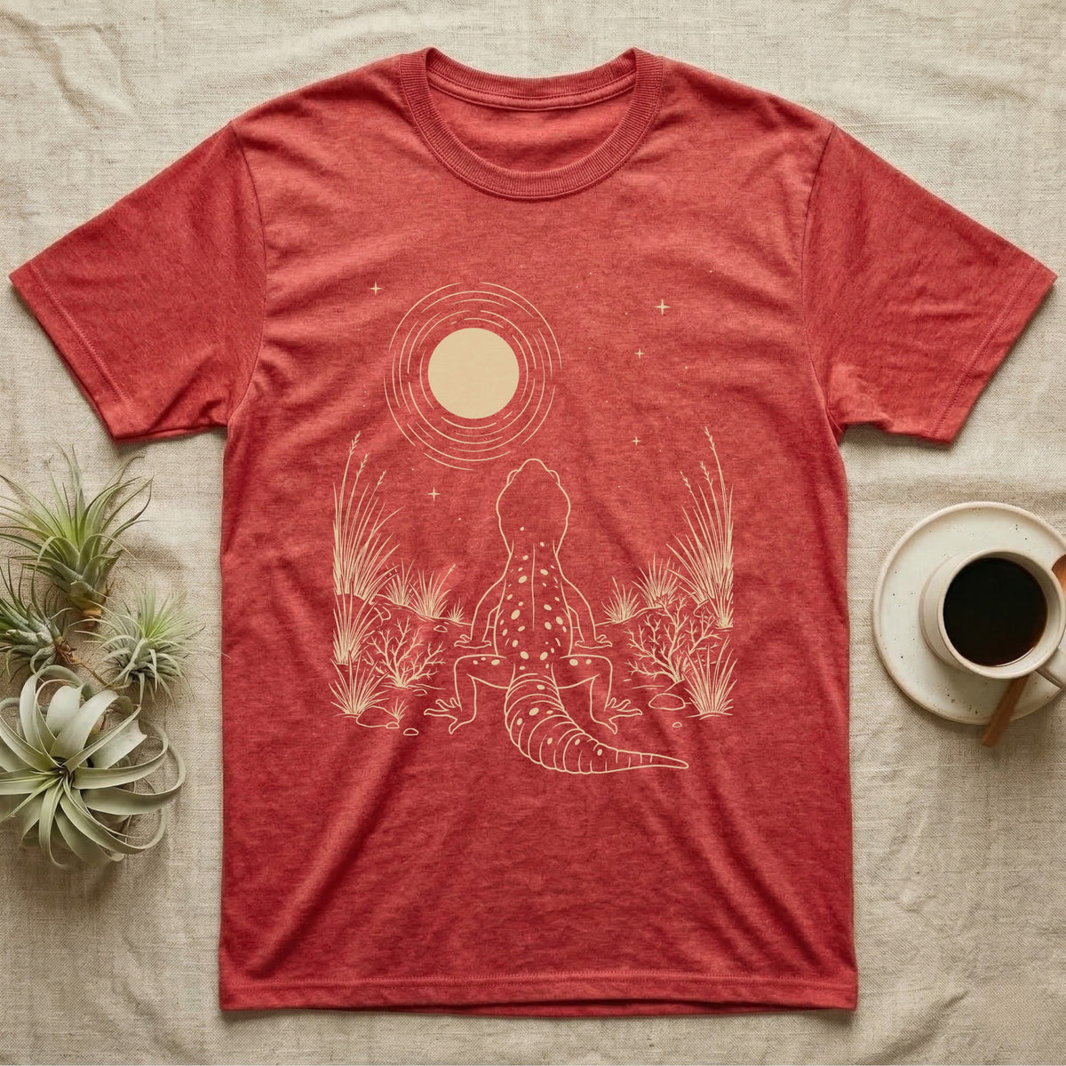 Leopard Gecko Moon T-Shirt in Heather Red — Scratchboard illustration of a leopard gecko seen from behind, looking up at a scratched moon over dry grasses.