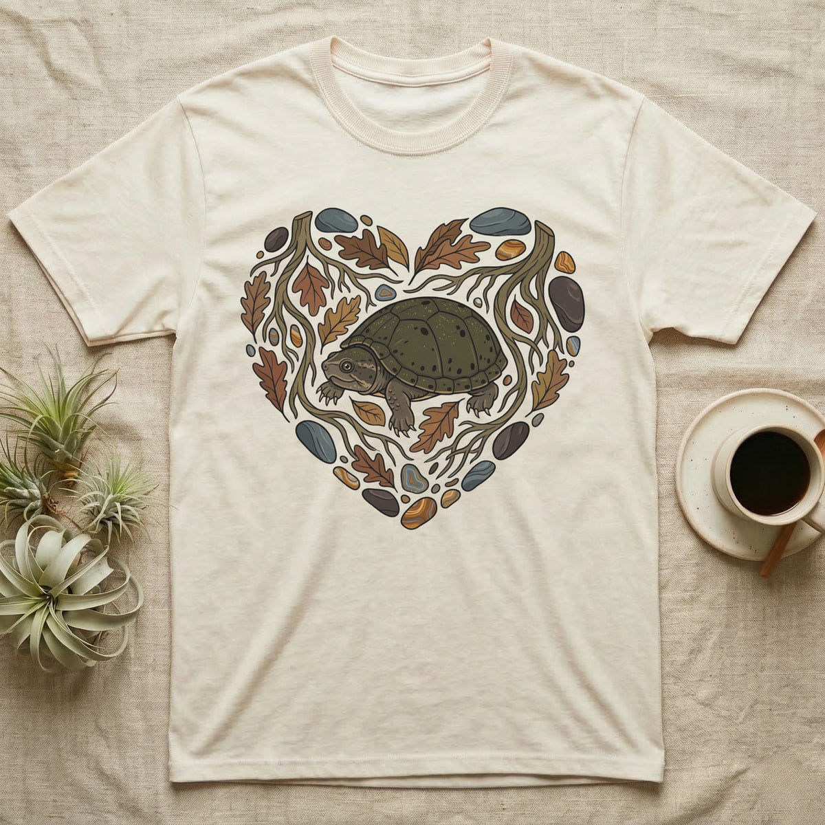 T-shirt with a heart design of a turtle and autumn leaves.