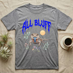 Northern Blue-Tongue Skink Feral T-Shirt in Sport Grey — Blue-tongue skink with its blue tongue out under a jagged cobalt-blue metal "ALL BLUFF" wordmark and pastel leaves.