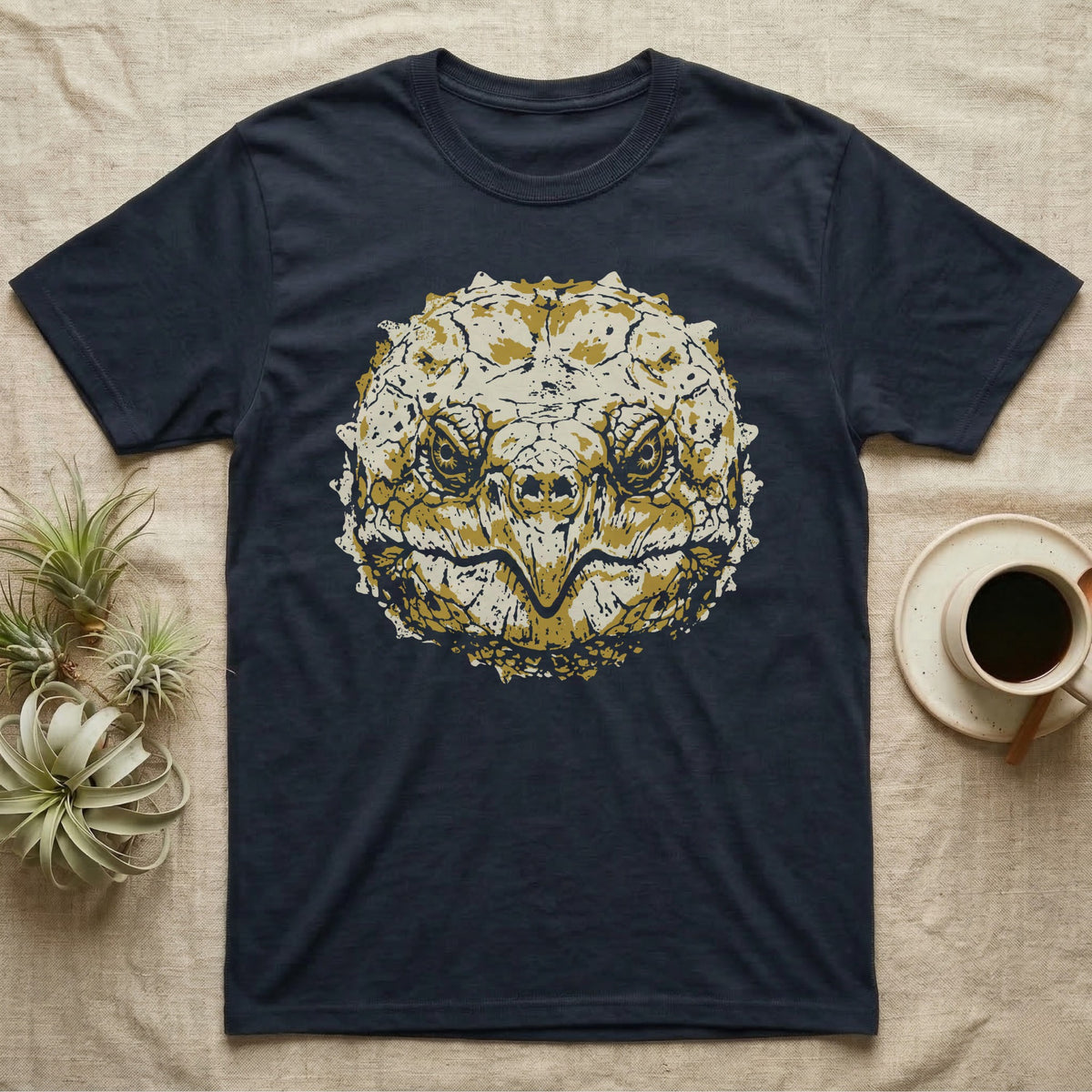 Alligator Snapper Face T-Shirt in Navy — Two-ink stencil of an alligator snapping turtle face, head-on, hooked beak closed, olive-gold eyes on black.
