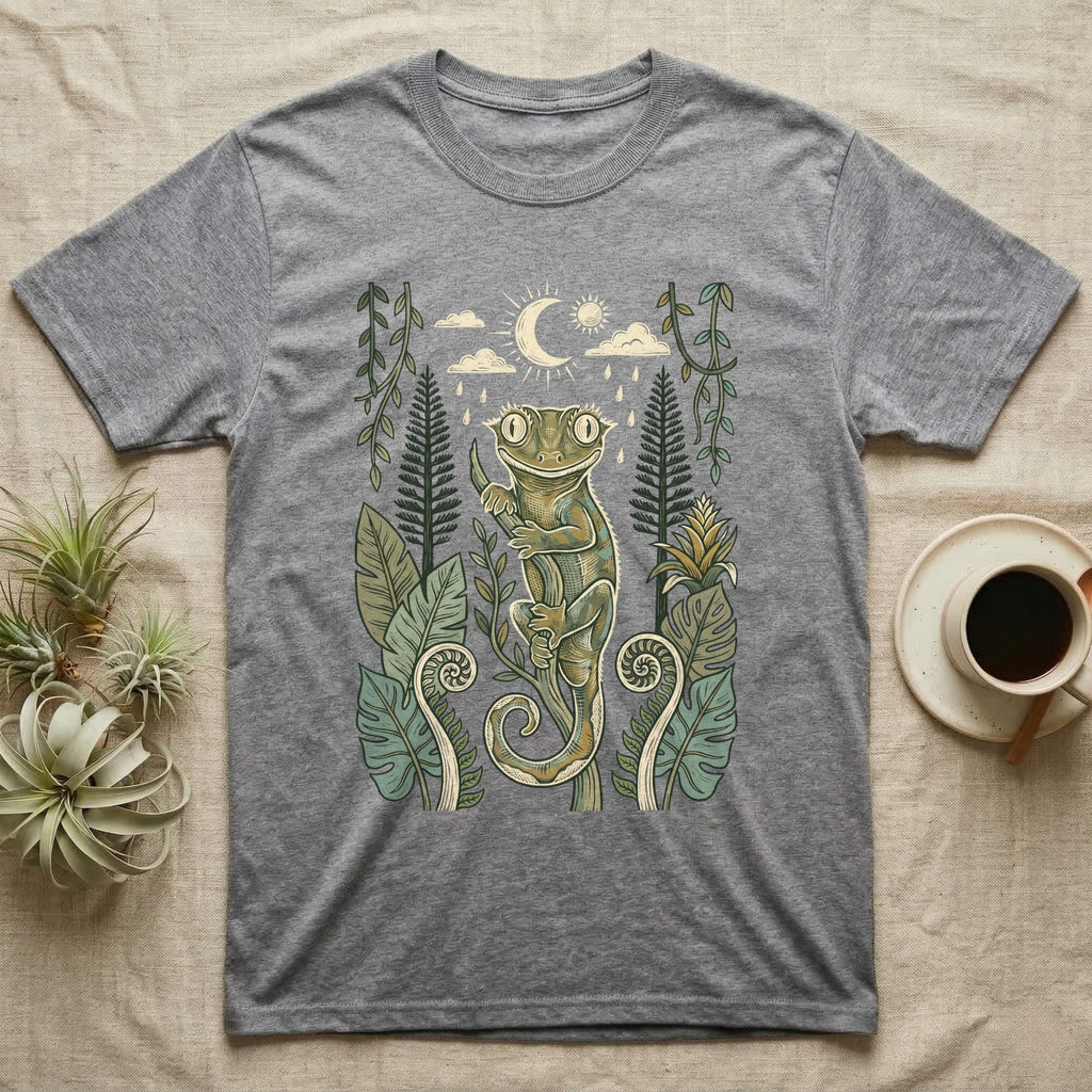 Crested Gecko Rainforest T-Shirt in Sport Grey — Linocut-style crested gecko clinging to a branch under a crescent moon, framed by rainforest ferns, pines and leaves.