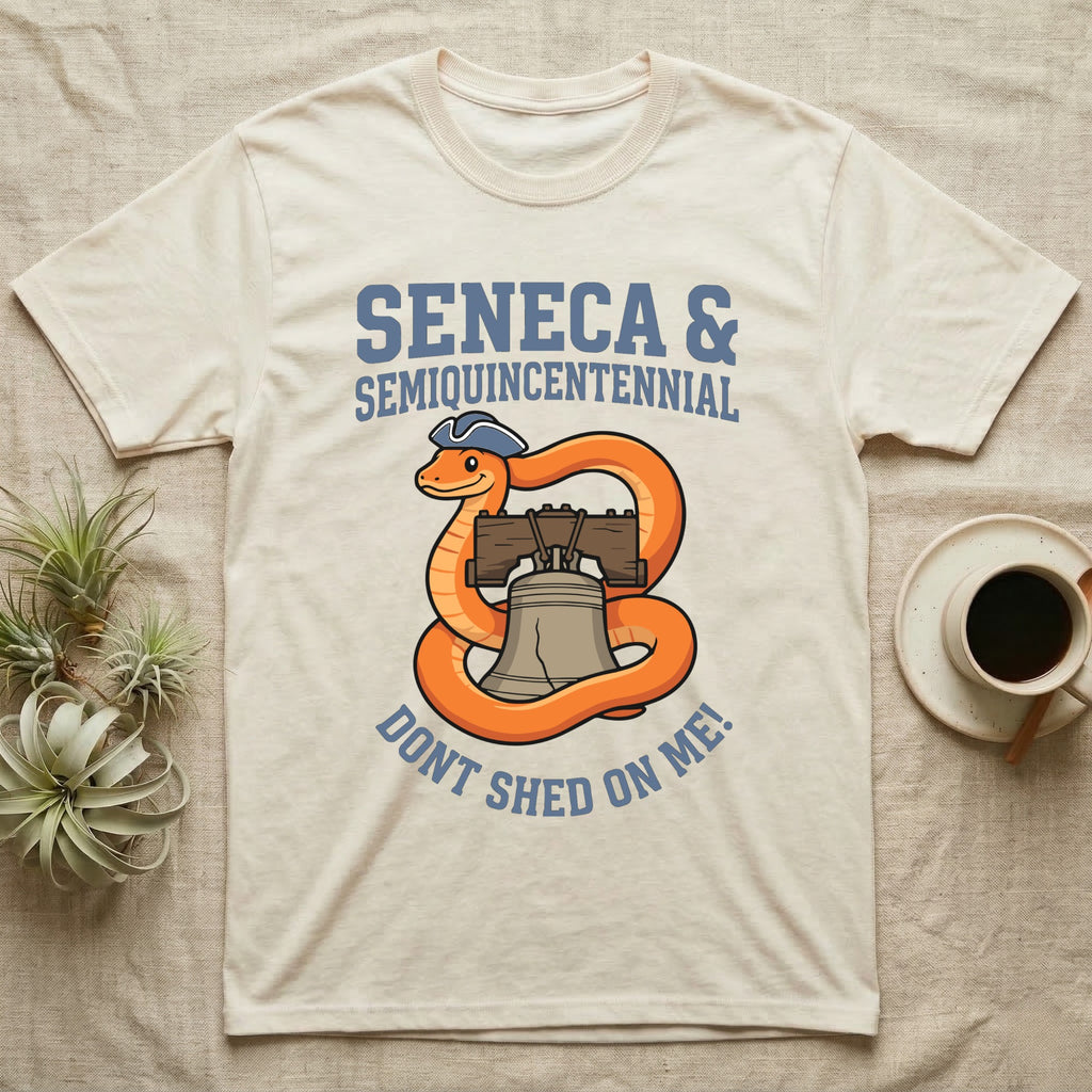Corn Snake Don't Shed T-Shirt in Natural — Cartoon orange snake in a tricorn hat coiled around the Liberty Bell with text Don't Shed On Me.