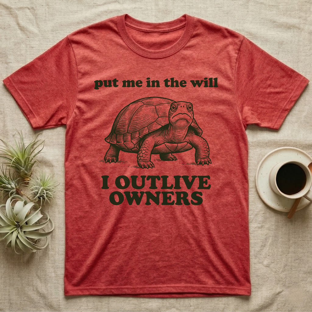 Box Turtle Inheritance T-Shirt in Heather Red — Engraved eastern box turtle standing head-on between the words put me in the will and I OUTLIVE OWNERS.