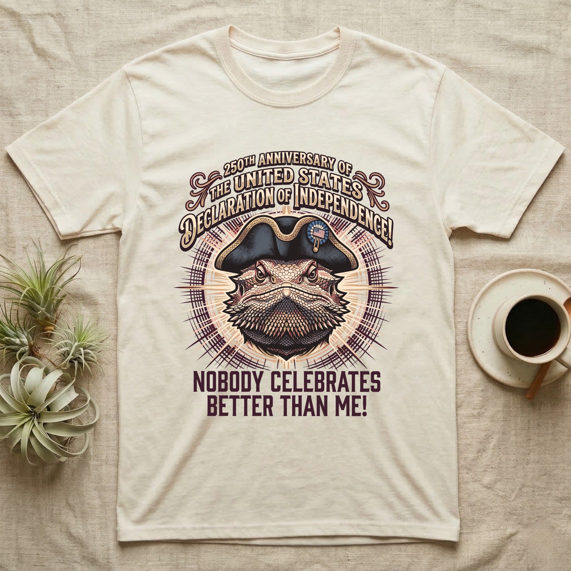 Bearded Dragon Declaration T-Shirt in Natural — Ornate engraved bearded dragon portrait in a tricorn hat on a cream sunburst with Nobody Celebrates Better Than Me.
