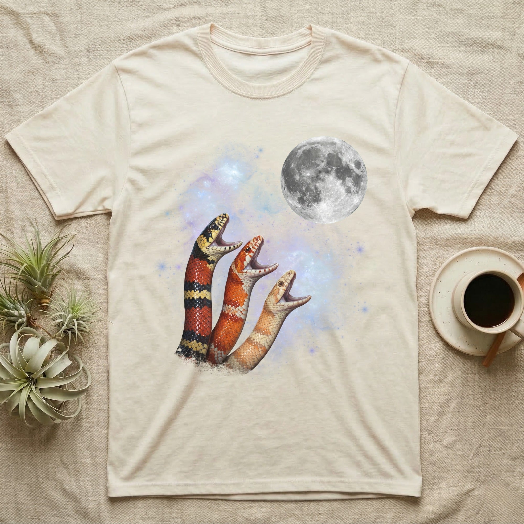 Milk Snake Moon Howl T-Shirt in Natural — Three Milk Snake colour morphs howling at a full moon over a nebula on a dark grey t-shirt.