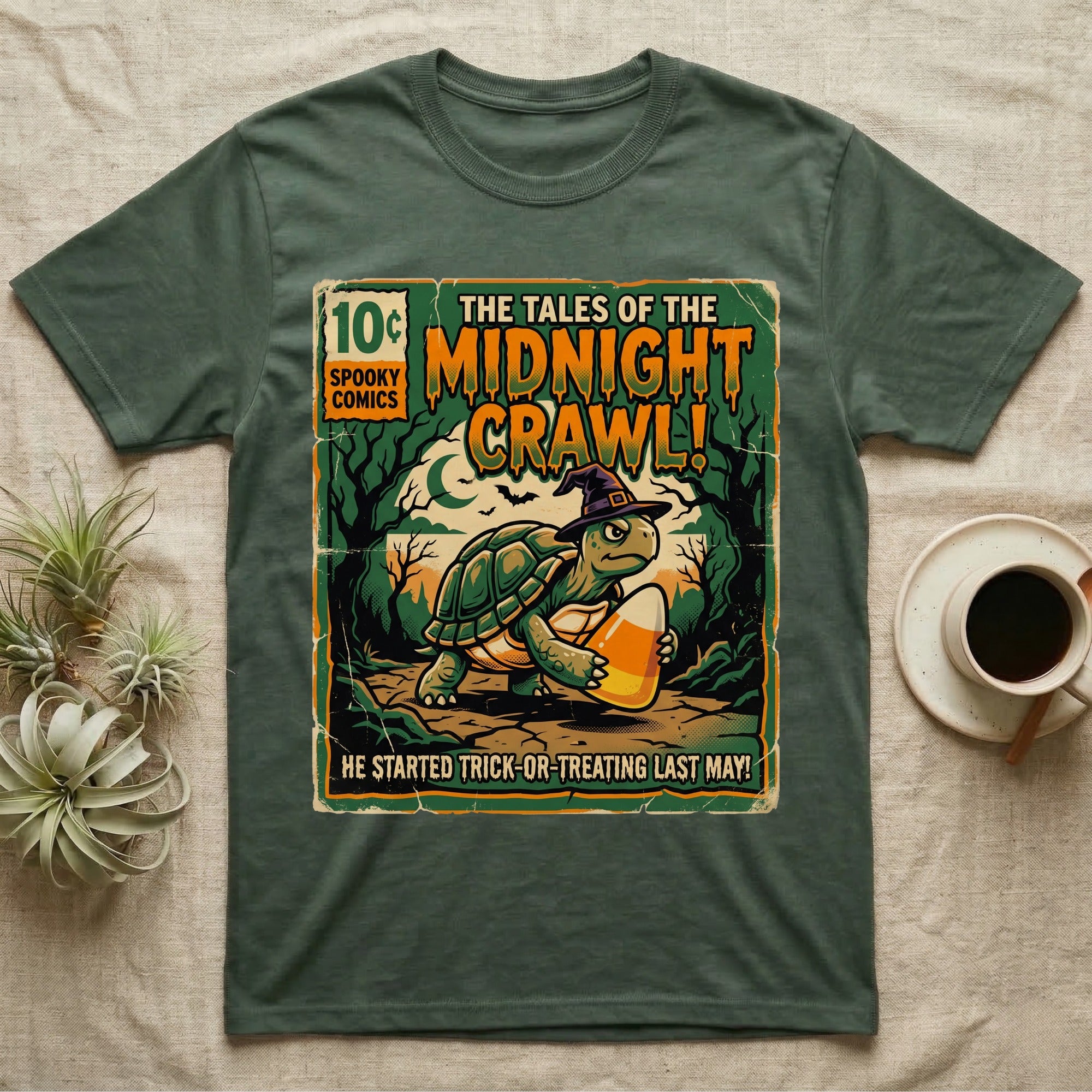 Tortoise Midnight Crawl Comic T-Shirt in Military Green — Vintage comic cover of a witch-hatted tortoise with candy corn in a moonlit forest, "Tales of the Midnight Crawl."