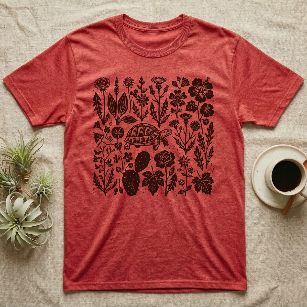 Hermann's Tortoise Forage T-Shirt in Heather Red — One-ink linocut of twenty forage plants with a small Hermann's tortoise walking among them
