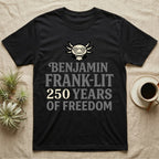 Axolotl Benjamin Franklin T-Shirt in Black — Flat cream axolotl as Ben Franklin in glasses above bold text reading Benjamin Frank-Lit, 250 Years of Freedom.