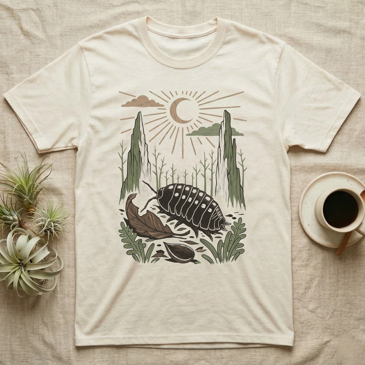Cubaris Isopod Home Range T-Shirt in Natural — Woodcut-style illustration of a Cubaris isopod walking across leaf litter with cypress knees and saplings behind, no on-shirt text.