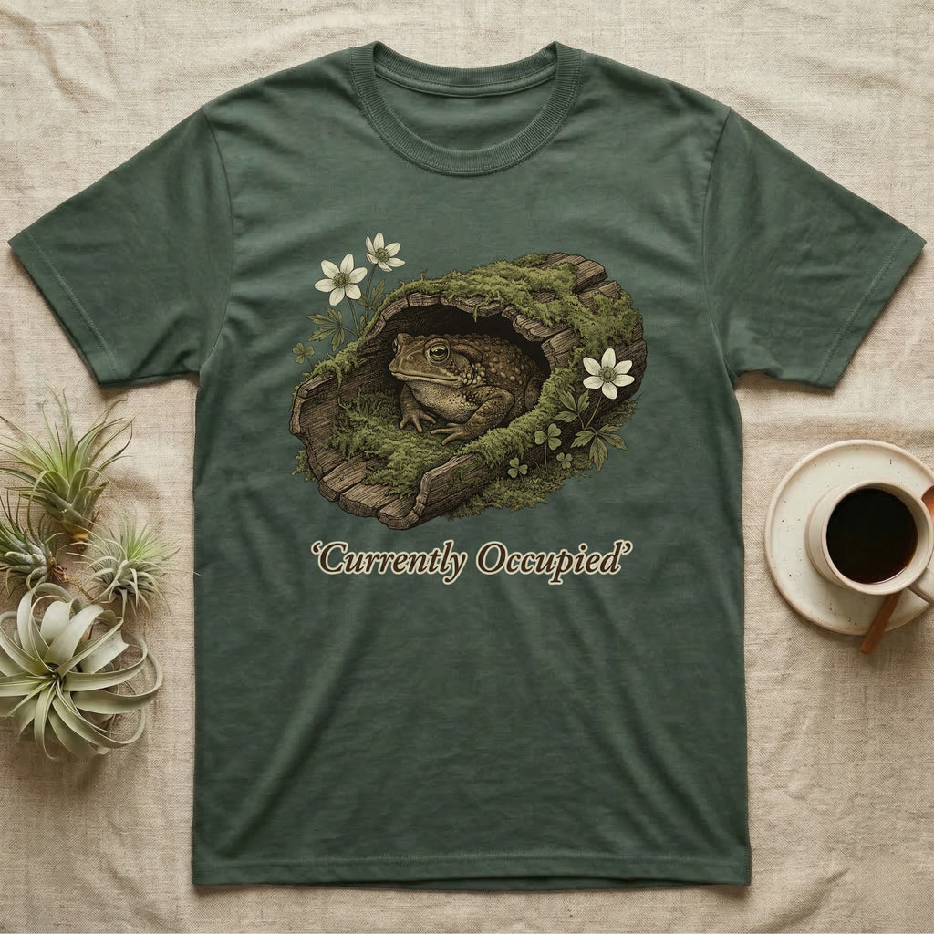 Green t-shirt with toad in a log with text "Currently Occupied".