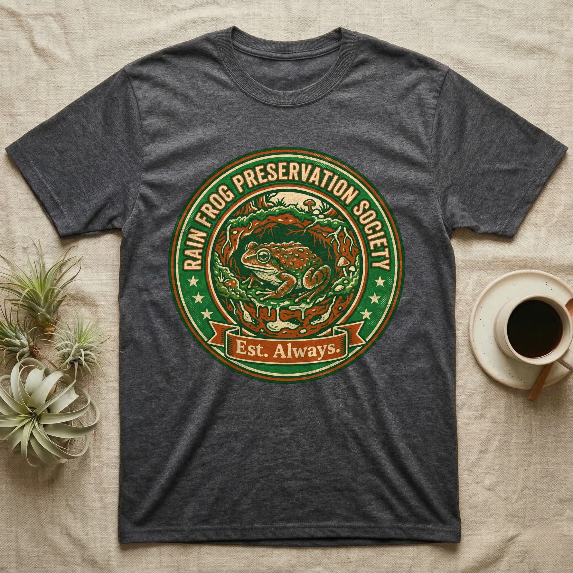 Dark grey t-shirt featuring a circular logo for the Rain Frog Preservation Society.