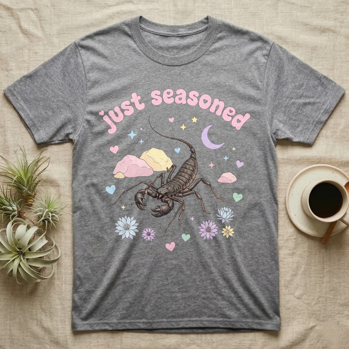 Giant Vinegaroon Baby T-Shirt in Sport Grey — Pastel giant vinegaroon with pincers and whip tail among rocks and a crescent moon, puffy pink wordmark "just seasoned" above.