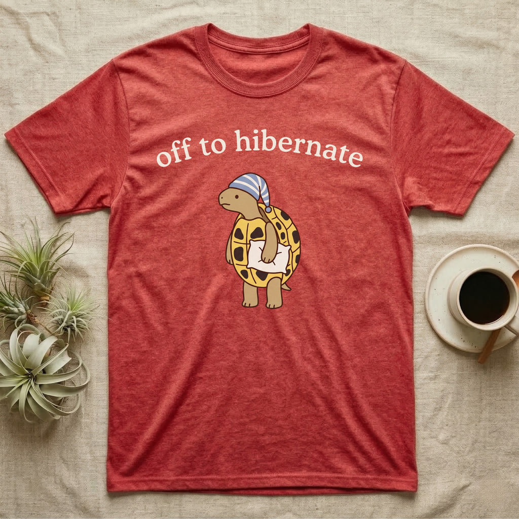 Hermann's Tortoise Hibernation T-Shirt in Heather Red — Minimal doodle of a Hermann's tortoise in a striped nightcap holding a pillow under the words off to hibernate