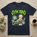 Green Anole Feral T-Shirt in Navy — Green anole mid push-up with flared pink dewlap under a jagged neon-lime metal "GYM BRO" wordmark and pastel ferns.