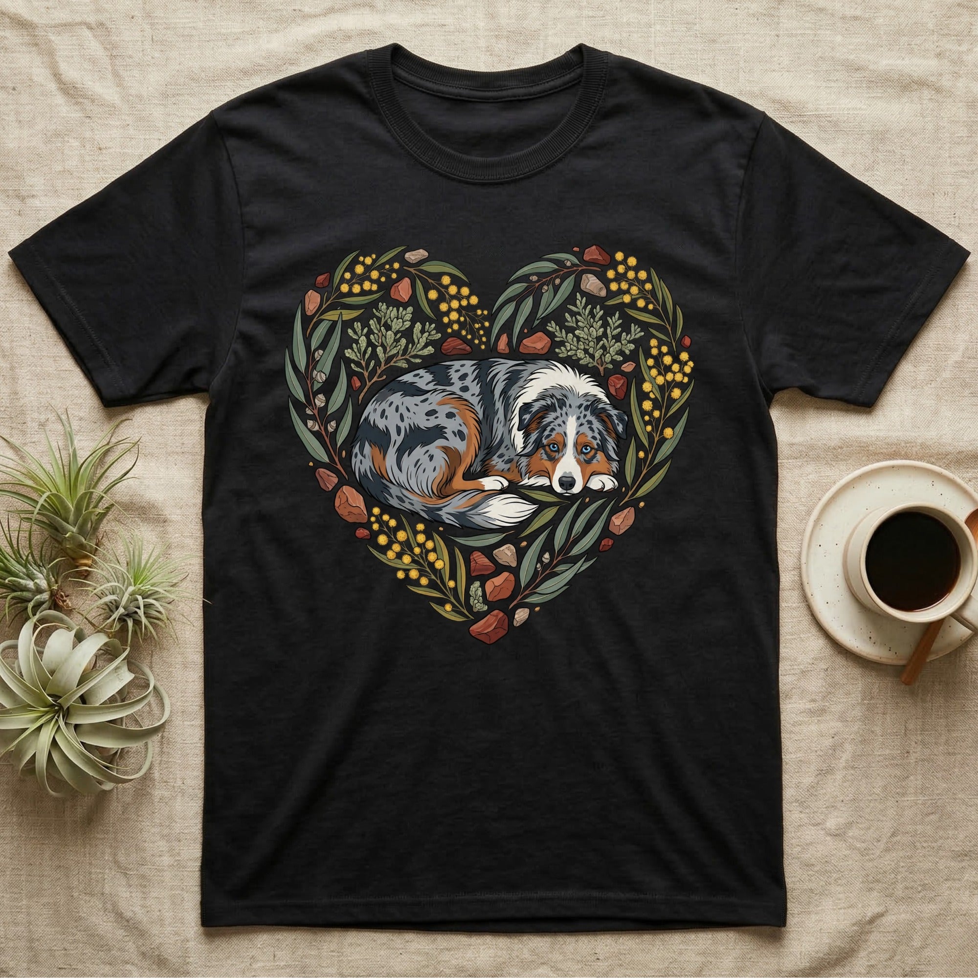 Black t-shirt with a dog's face framed by a heart-shaped floral and leaf design.