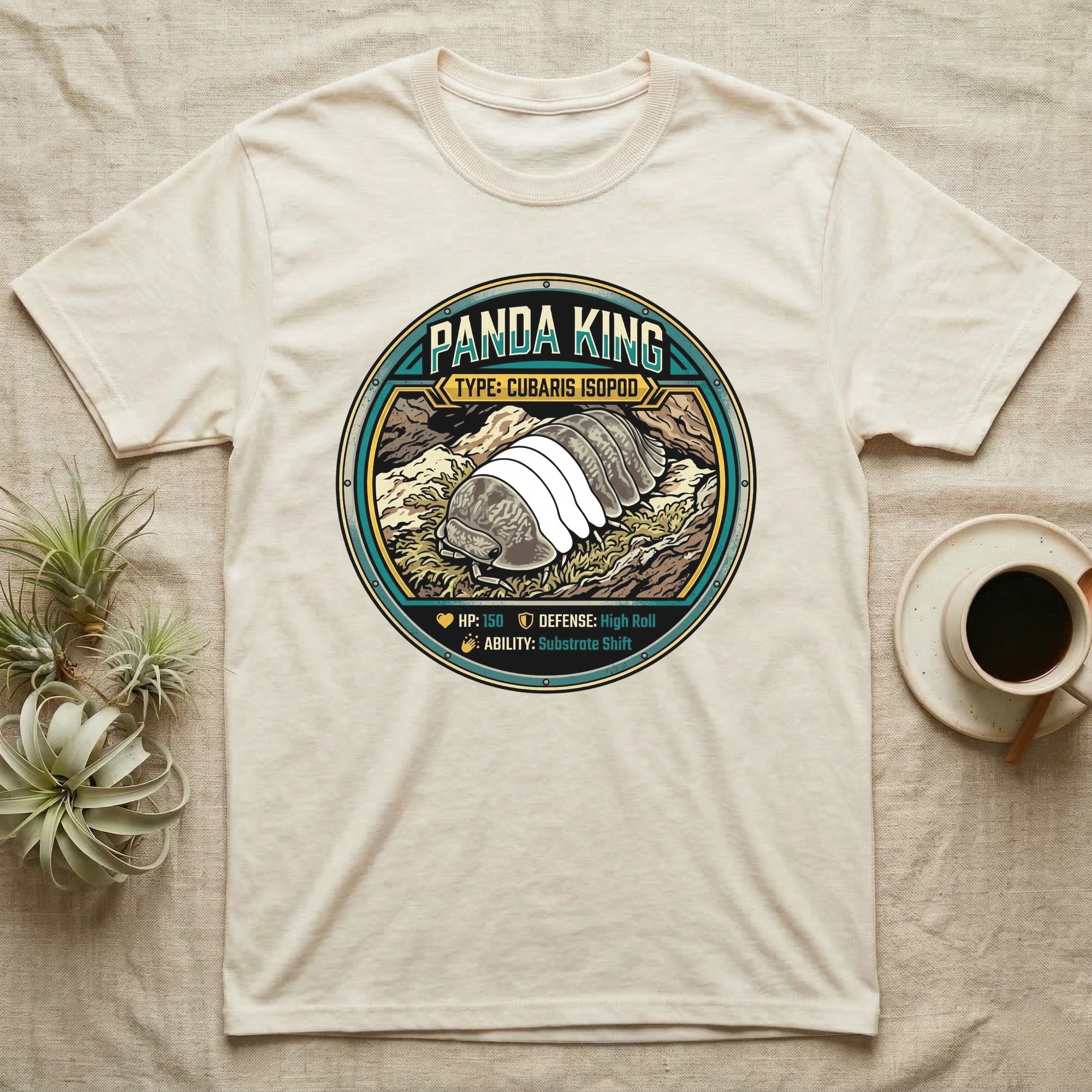 Panda King Isopod Trading Card T-Shirt in Natural — Metal stat-card badge showing a Panda King Cubaris isopod on limestone with HP and ability lines.