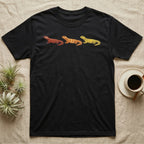 Uromastyx Colour Morph Trio T-Shirt in Black — Three uromastyx lizards in a row, painted in thick raised relief — brick red, tangerine orange and lemon yellow morphs.