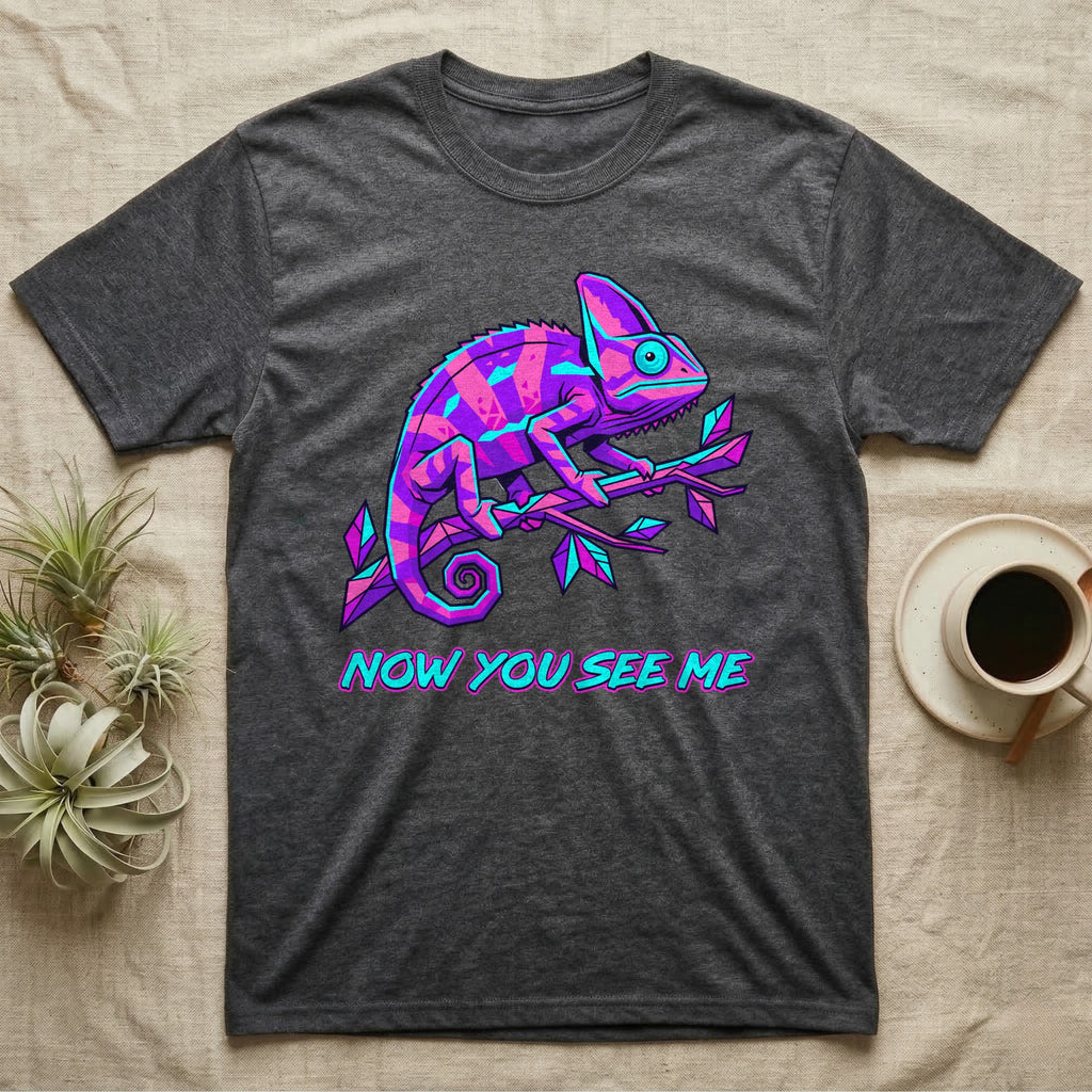 Dark t-shirt with neon purple and blue chameleon on branch, "NOW YOU SEE ME" text.