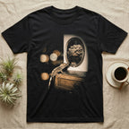 Crested Gecko Dinosaur Mirror T-Shirt in Black — Crested gecko on a nightstand looking into an oval mirror that reflects a large armoured dinosaur.