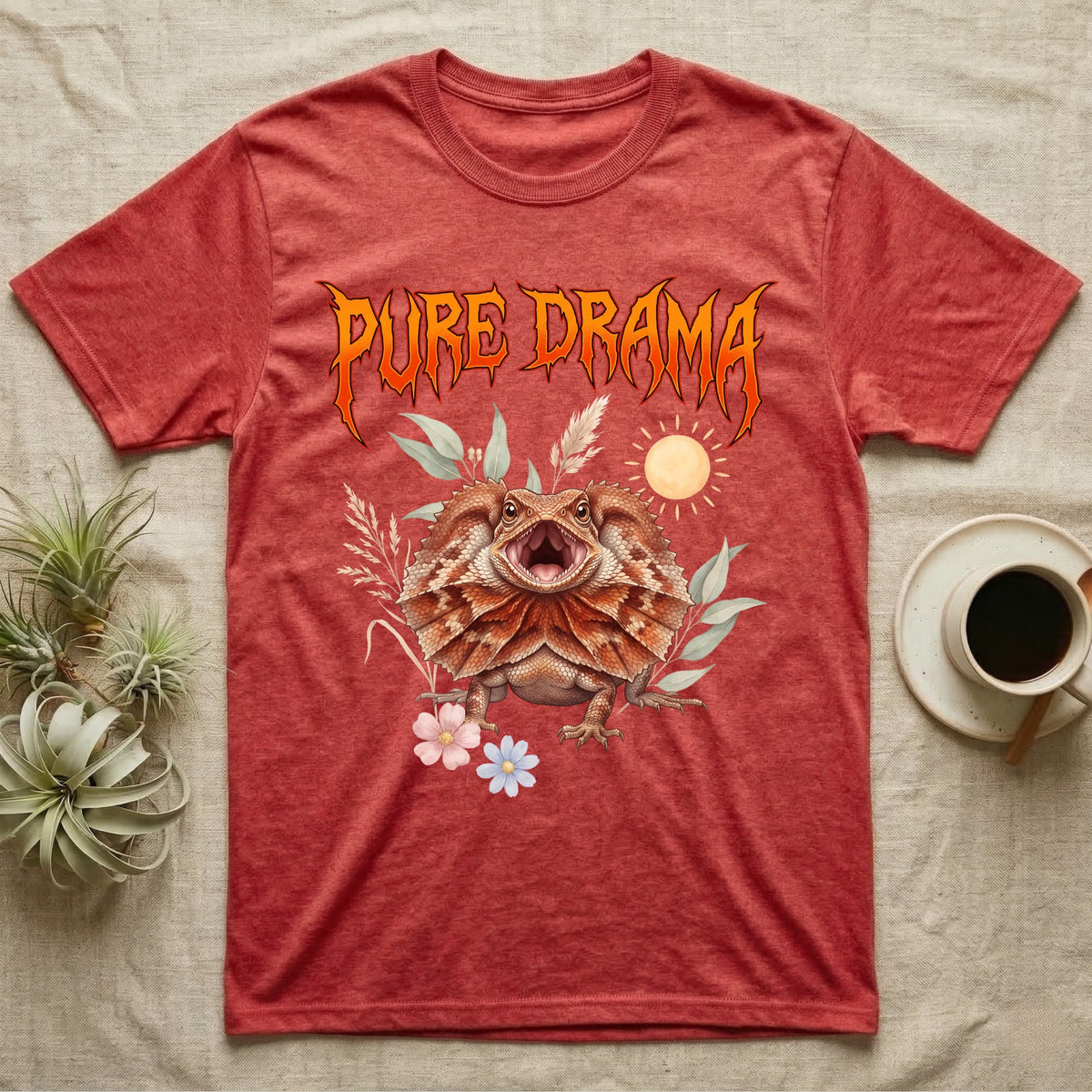 Frilled Dragon Feral T-Shirt in Heather Red — Frilled dragon with its neck frill flared and mouth gaping under a jagged fiery-orange metal "PURE DRAMA" wordmark.