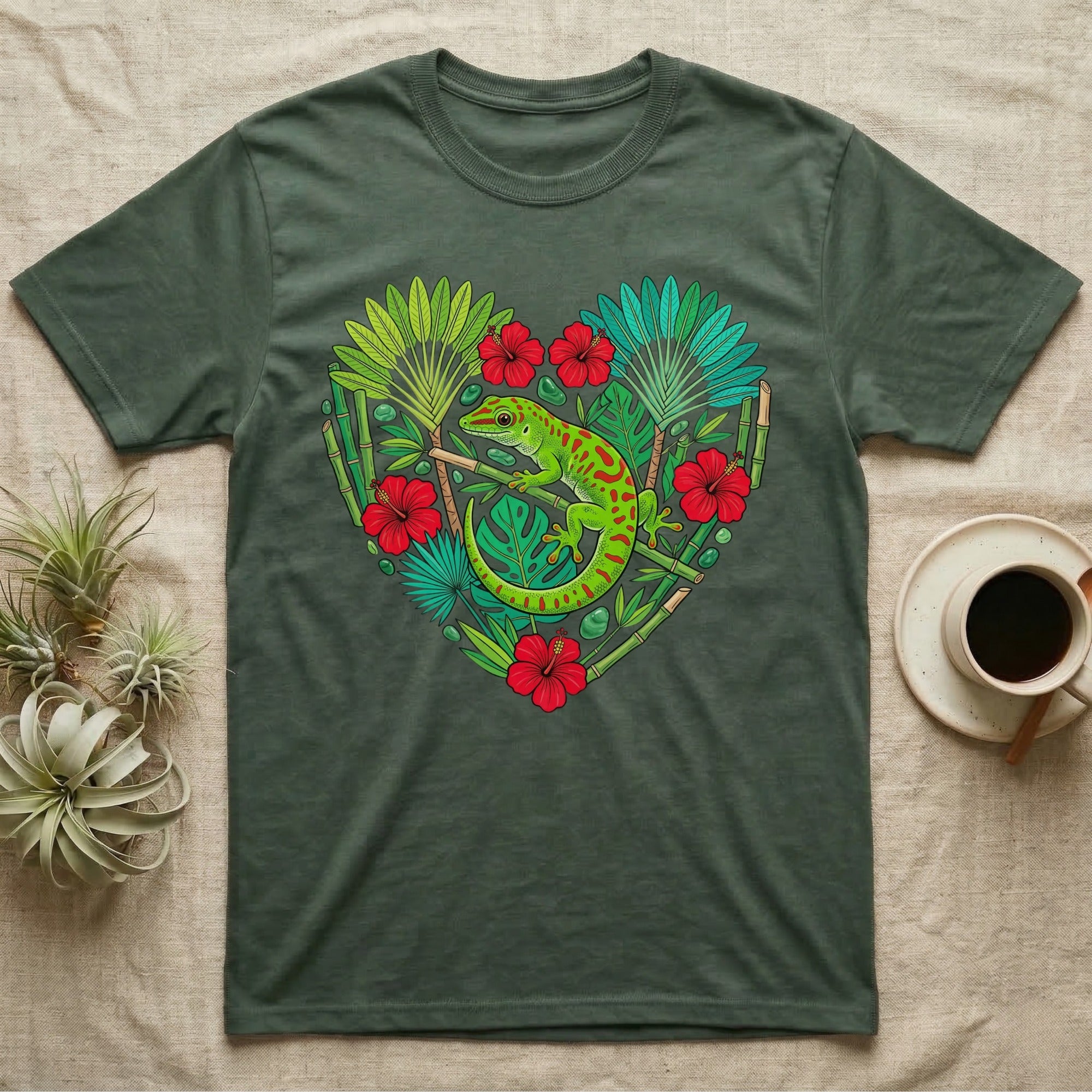 Green gecko on heart-shaped floral pattern t-shirt with bamboo accents.