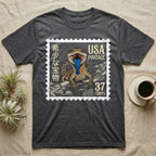 Dark t-shirt featuring a stamp with a blue-tongued lizard, USA postage, and Chinese characters.