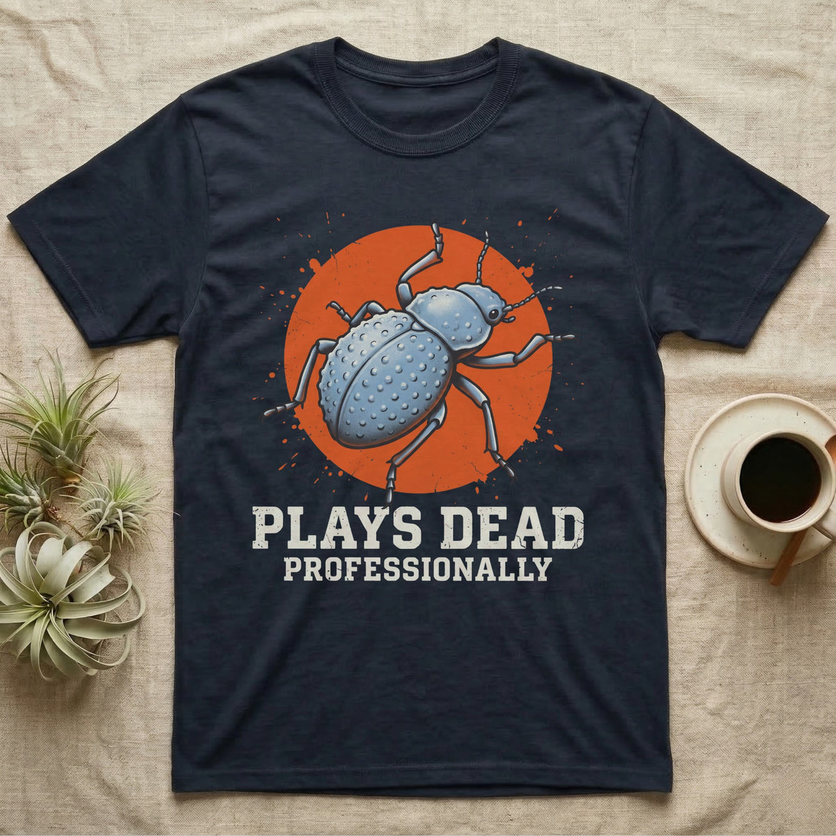 Blue Death Feigning Beetle T-Shirt in Navy — Distressed disc portrait of a blue death-feigning beetle over an orange circle with text plays dead