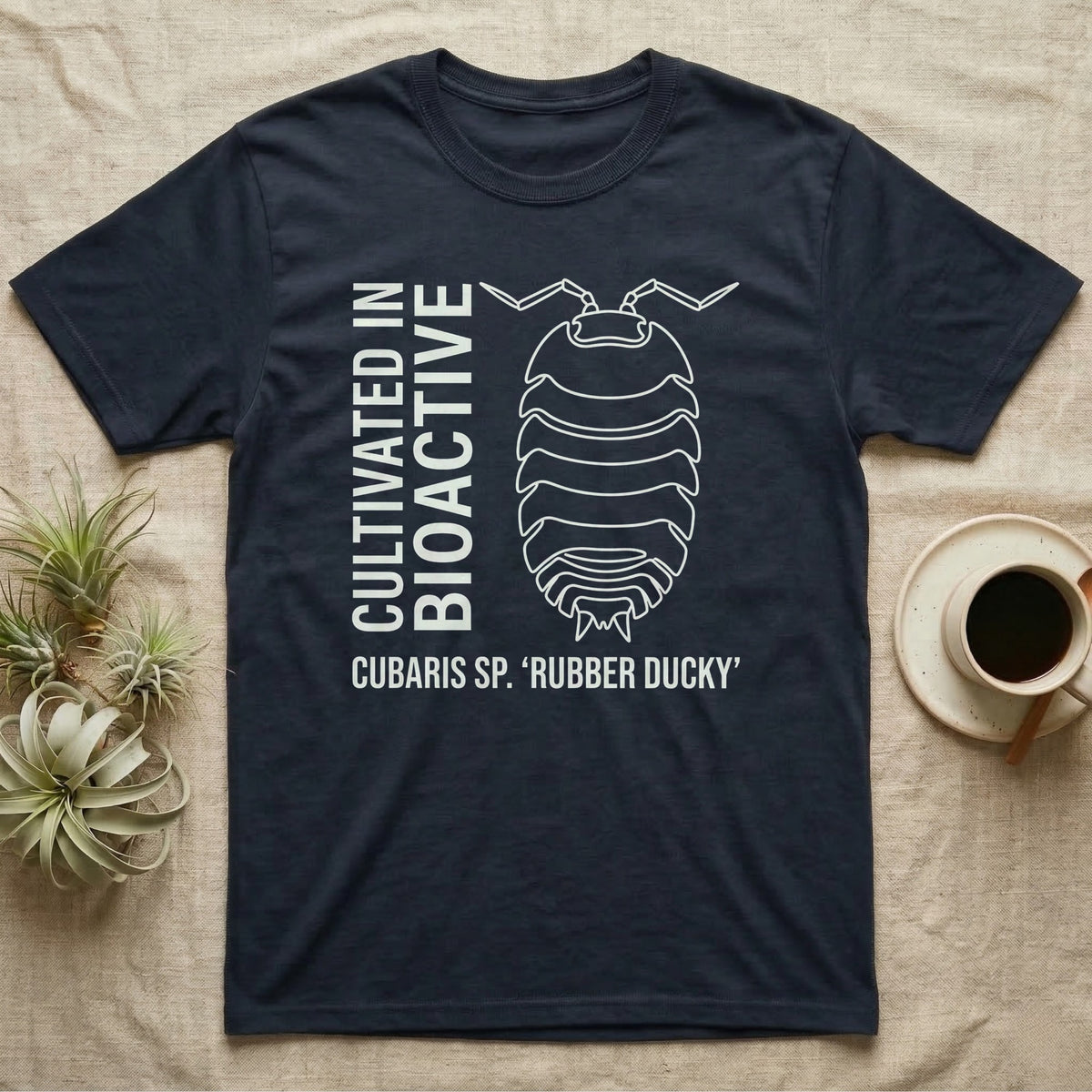 Rubber Ducky Isopod Line Art T-Shirt in Navy — Bone-white outline drawing of a rubber ducky isopod labelled Cubaris sp. beside vertical stencil type.