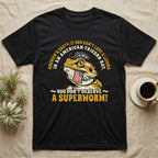 Bearded Dragon Tricorn Tee in Black — Bold woodcut tee of a bearded dragon in a colonial tricorn hat, gold and cream text reading You Don't Deserve A Superworm, on black.