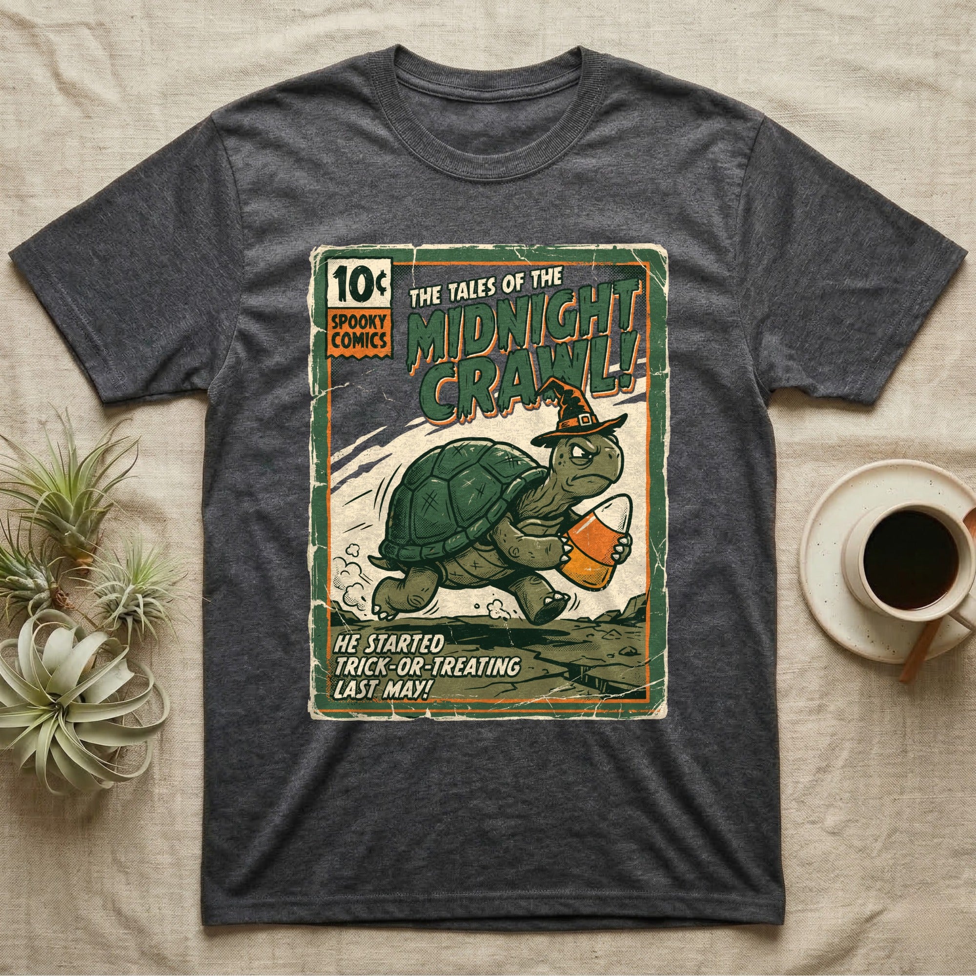 Tortoise Midnight Crawl Vintage T-Shirt in Dark Heather — Worn pulp comic cover of a witch-hatted tortoise dashing with a candy pail, "Tales of the Midnight Crawl."