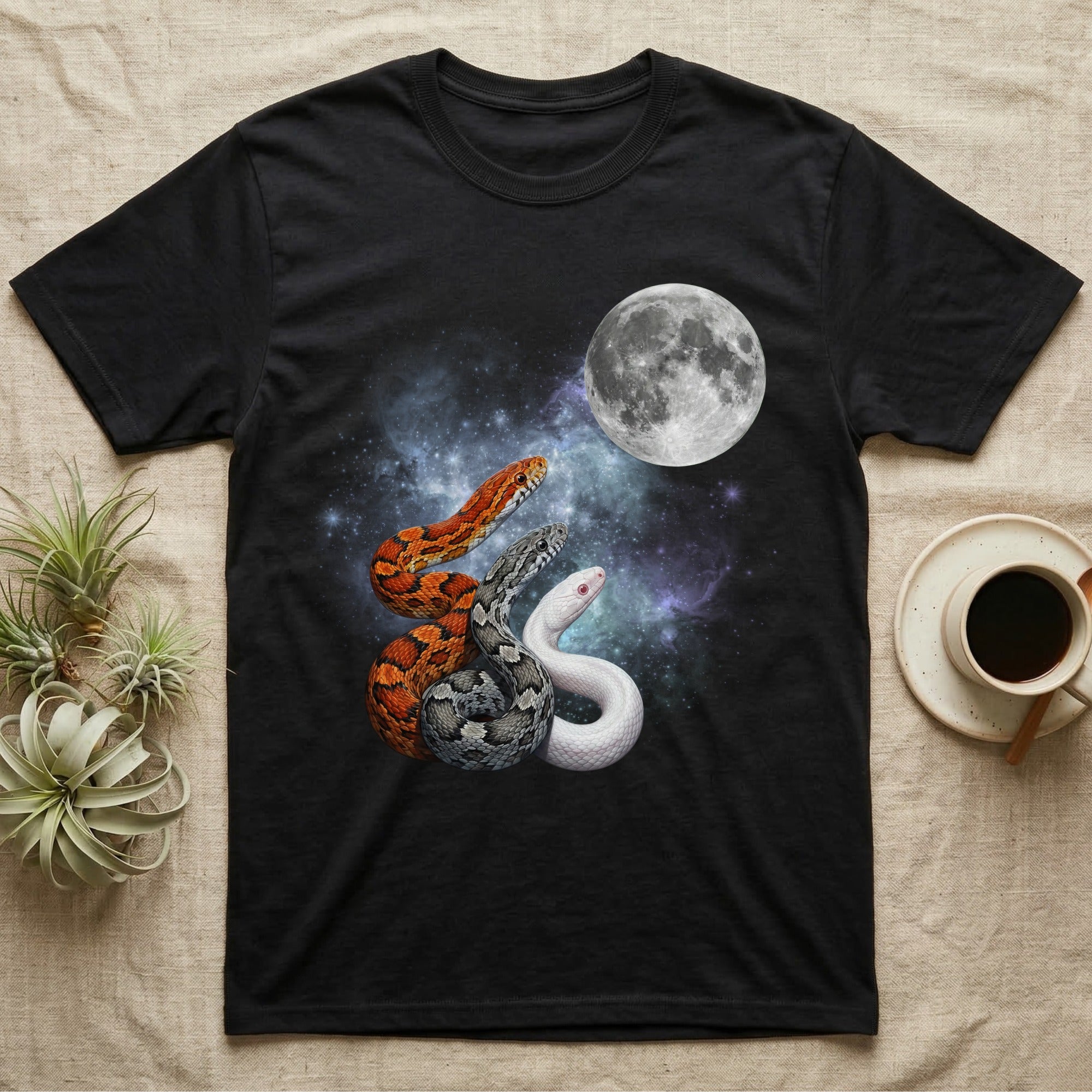 Corn Snake Moon Howl T-Shirt in Black — Three Corn Snake colour morphs howling at a full moon over a nebula on a dark grey t-shirt.