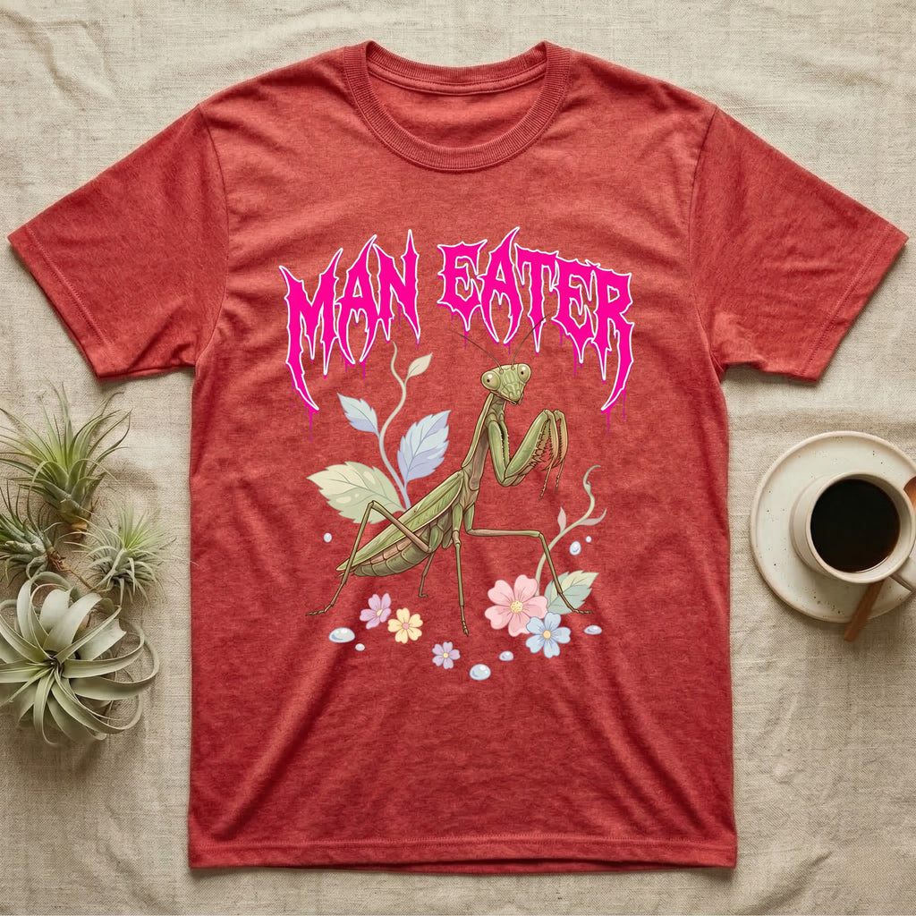 Chinese Mantis Feral T-Shirt in Heather Red — Pastel Chinese mantis with raised spiked forelegs among leaves and blossoms, jagged magenta metal wordmark "MAN EATER" above.