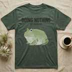 Pacman Frog Doing Nothing T-Shirt in Military Green — Watercolour pacman frog blob in profile below the words doing nothing on purpose, on grey