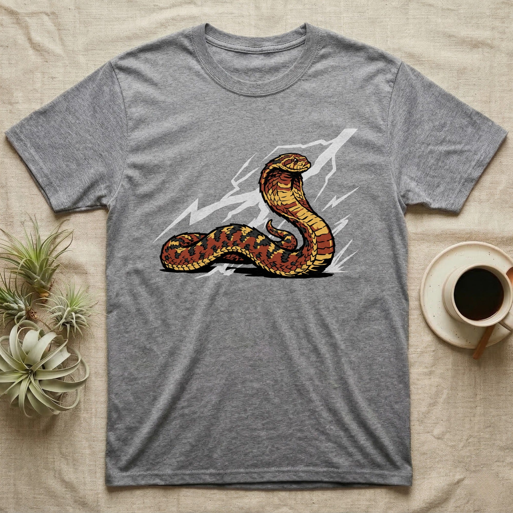 Gray t-shirt with a coiled cobra snake design and lightning bolts.
