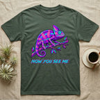 Green t-shirt with a neon pink and purple chameleon on a branch and text "NOW YOU SEE ME".