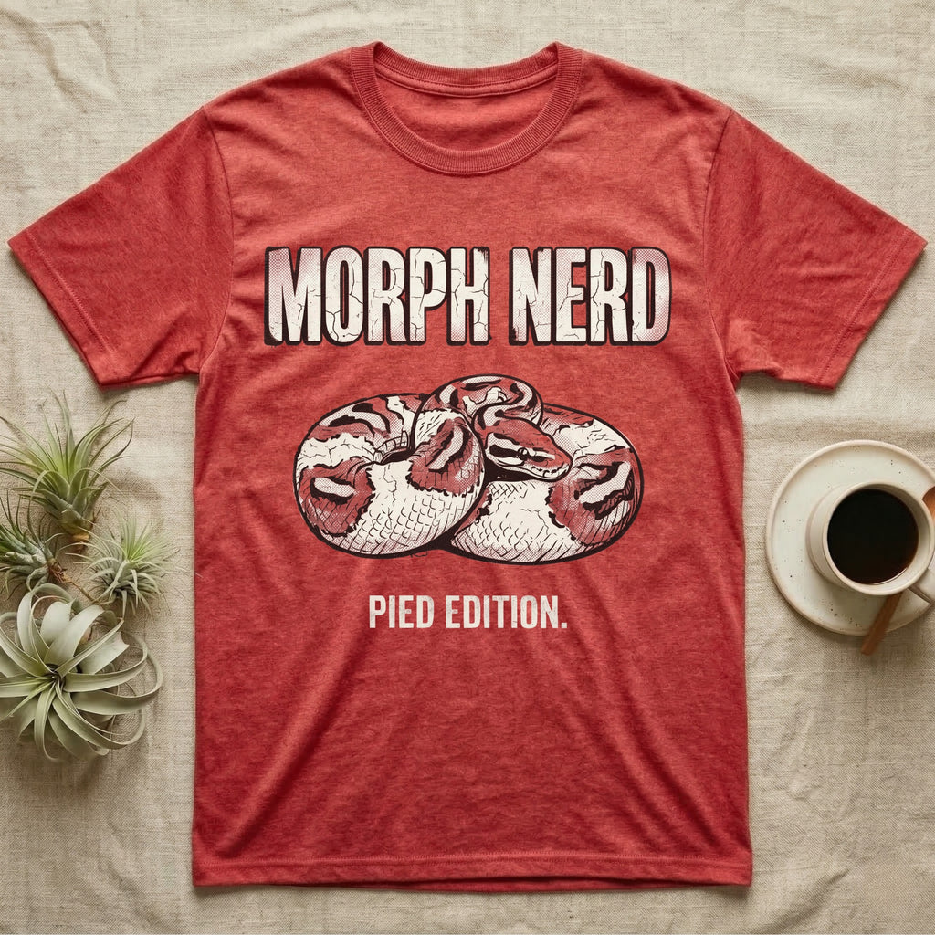 Pied Ball Python Morph T-Shirt in Heather Red — Grunge type "Morph Nerd" with a small pied-morph ball python coiled mid-design and "Pied Edition" caption beneath.