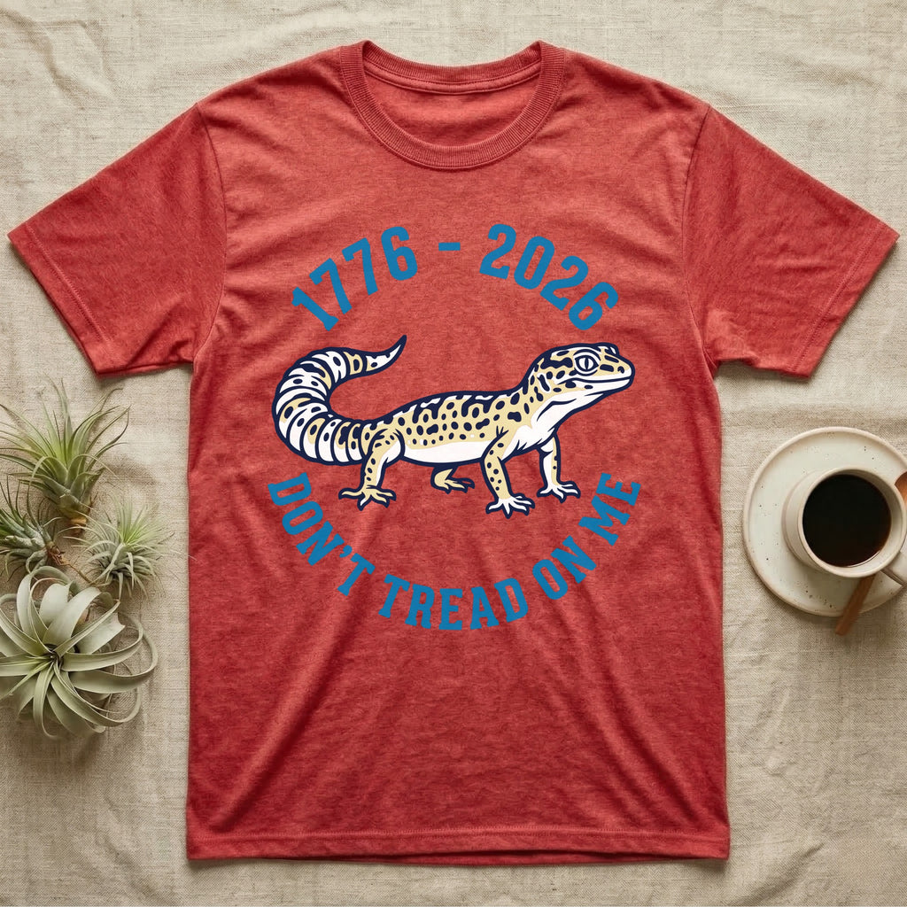 Leopard Gecko 1776 T-Shirt in Heather Red — Two-colour vector leopard gecko in profile ringed by arched text reading 1776 to 2026 and Don't Tread On Me.