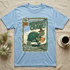 Tortoise Midnight Crawl Vintage T-Shirt in Light Blue — Worn pulp comic cover of a witch-hatted tortoise dashing with a candy pail, "Tales of the Midnight Crawl."