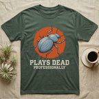 Blue Death Feigning Beetle T-Shirt in Military Green — Distressed disc portrait of a blue death-feigning beetle over an orange circle with text plays dead