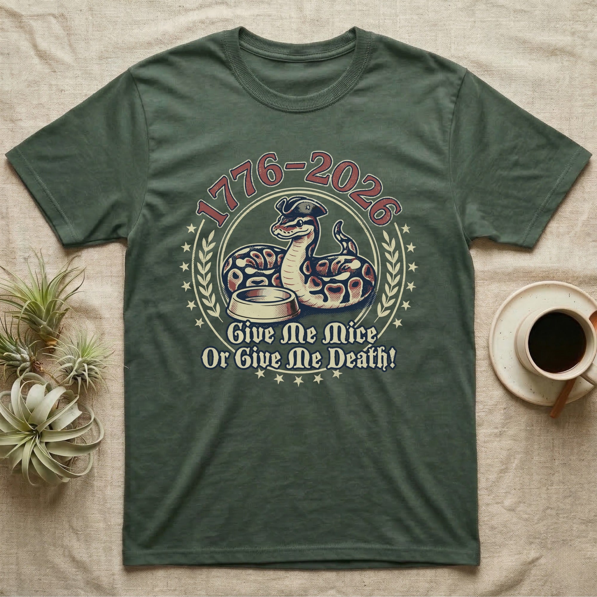 Ball Python 1776 T-Shirt in Military Green — Vintage distressed badge of a ball python in a feeding strike over a food dish, cream and brick-red emblem reading Give Me Mice Or Give Me Death.