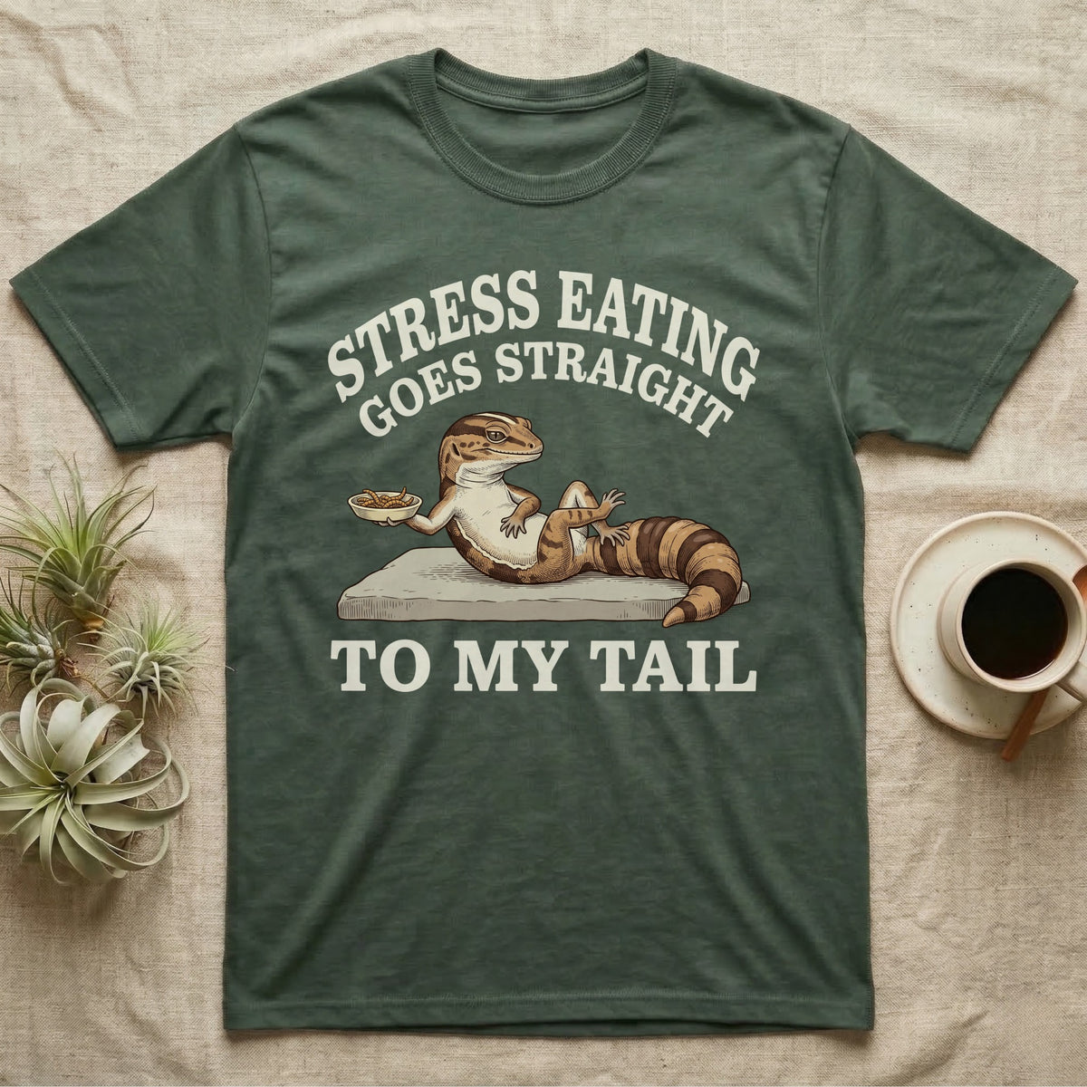 Fat-Tailed Gecko Snacking T-Shirt in Military Green — Engraved fat-tailed gecko lounging on a stone with mealworms under Stress Eating Goes Straight To My Tail